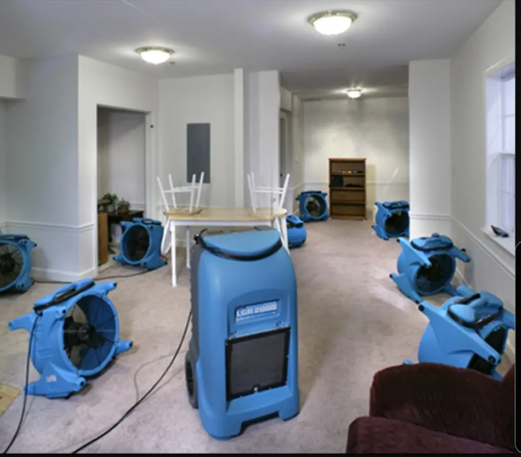 Air movers and dehumidifier setup for Water Damage Restoration in Roma